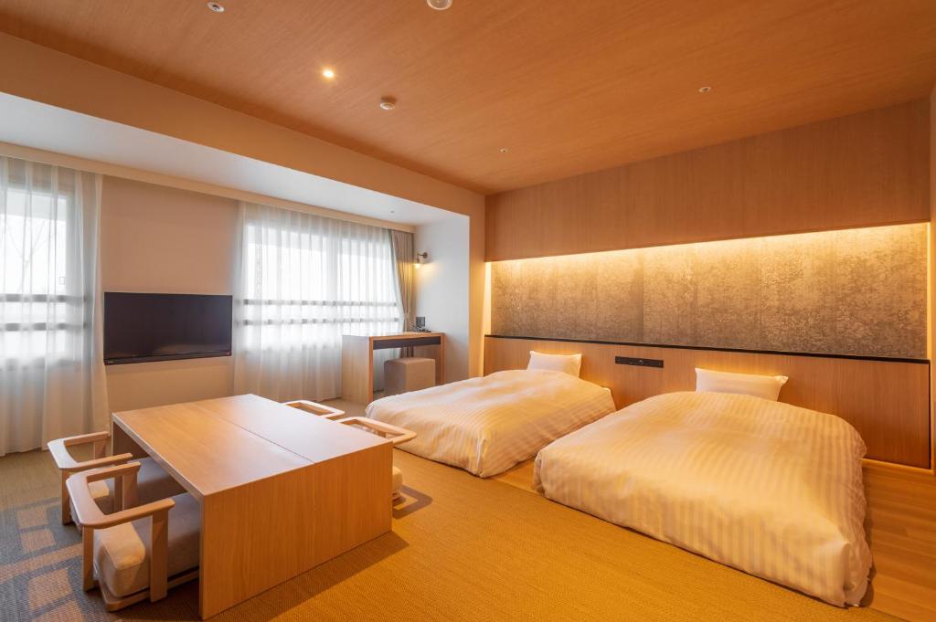 Postel nebo postele na pokoji v ubytování Lime Resort Myoko
