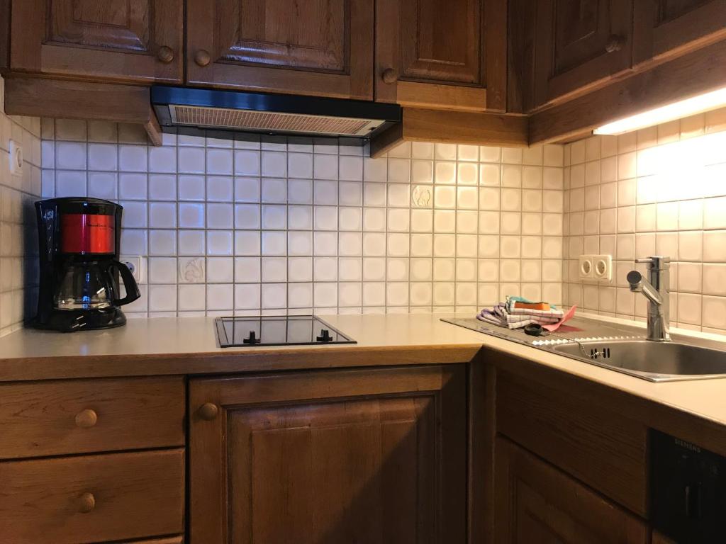 Kuchyň nebo kuchyňský kout v ubytování Appartements Rosenstockl