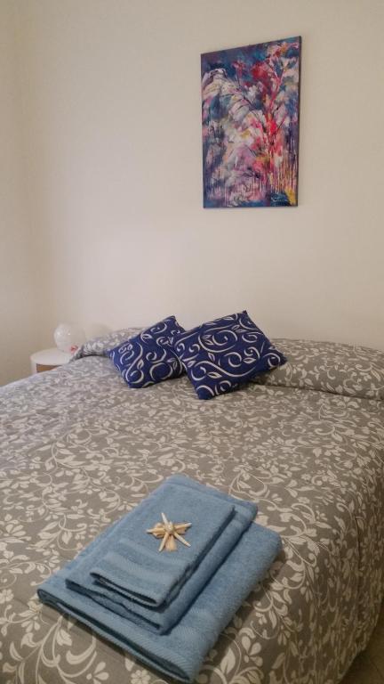 A bed or beds in a room at Il Soffione Home
