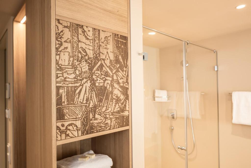 Koupelna v ubytování Das ACKER Hotel
