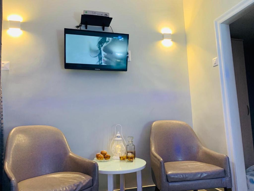 TV a/nebo společenská místnost v ubytování Motel Hofim