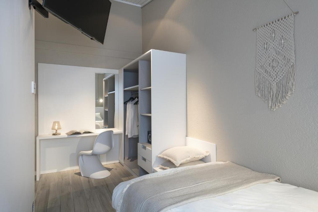 Een bed of bedden in een kamer bij CP Resort