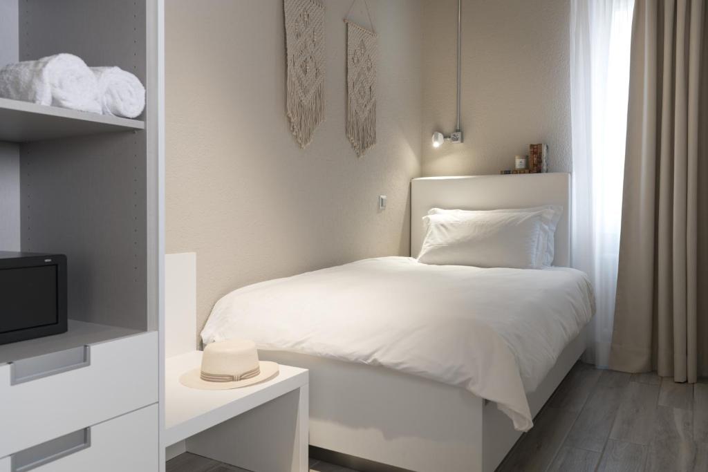 Een bed of bedden in een kamer bij CP Resort