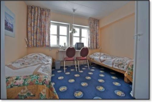 Postel nebo postele na pokoji v ubytování Hotel Kulusuk