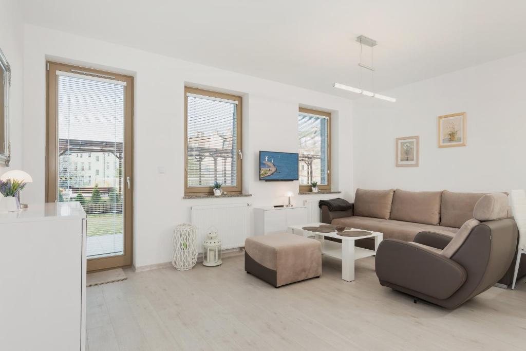 Posezení v ubytování Wind Rose Quarter Apartments by Noclegi Renters