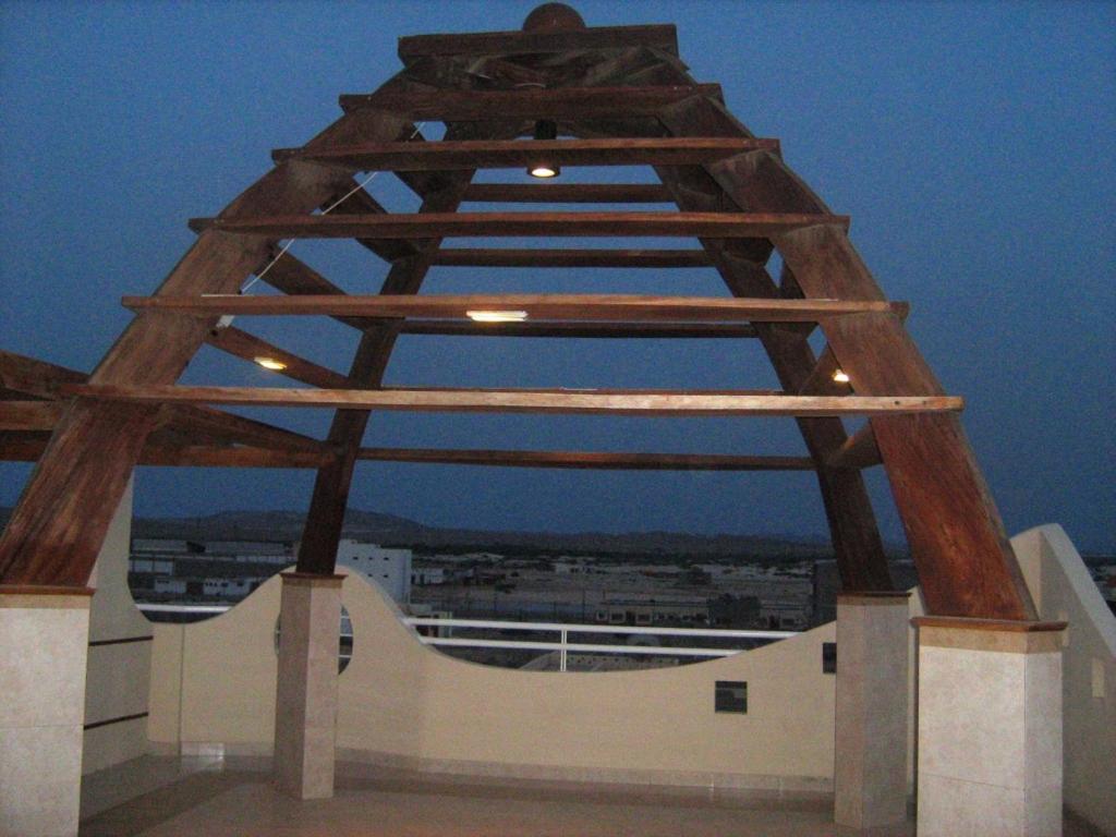 a wooden tower on top of a building at Boa Vista Water Sport in Sal Rei