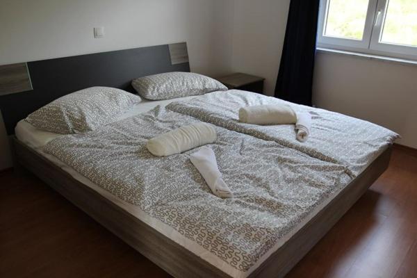 Postel nebo postele na pokoji v ubytování ARA-MARINA