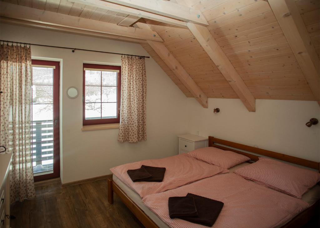 Postel nebo postele na pokoji v ubytování Apartmány Fišerka