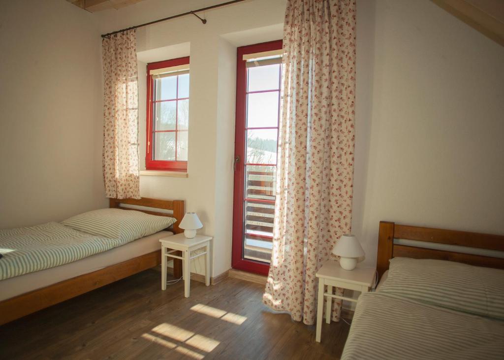 Postel nebo postele na pokoji v ubytování Apartmány Fišerka