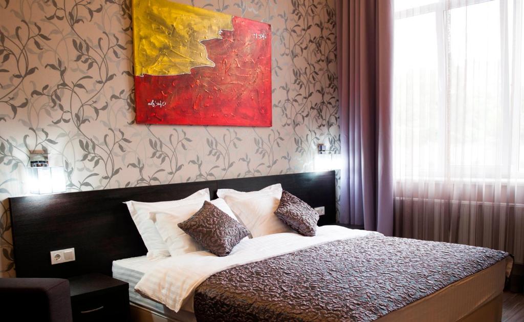 Postel nebo postele na pokoji v ubytování Boutique Apart - Hotel iArcadia
