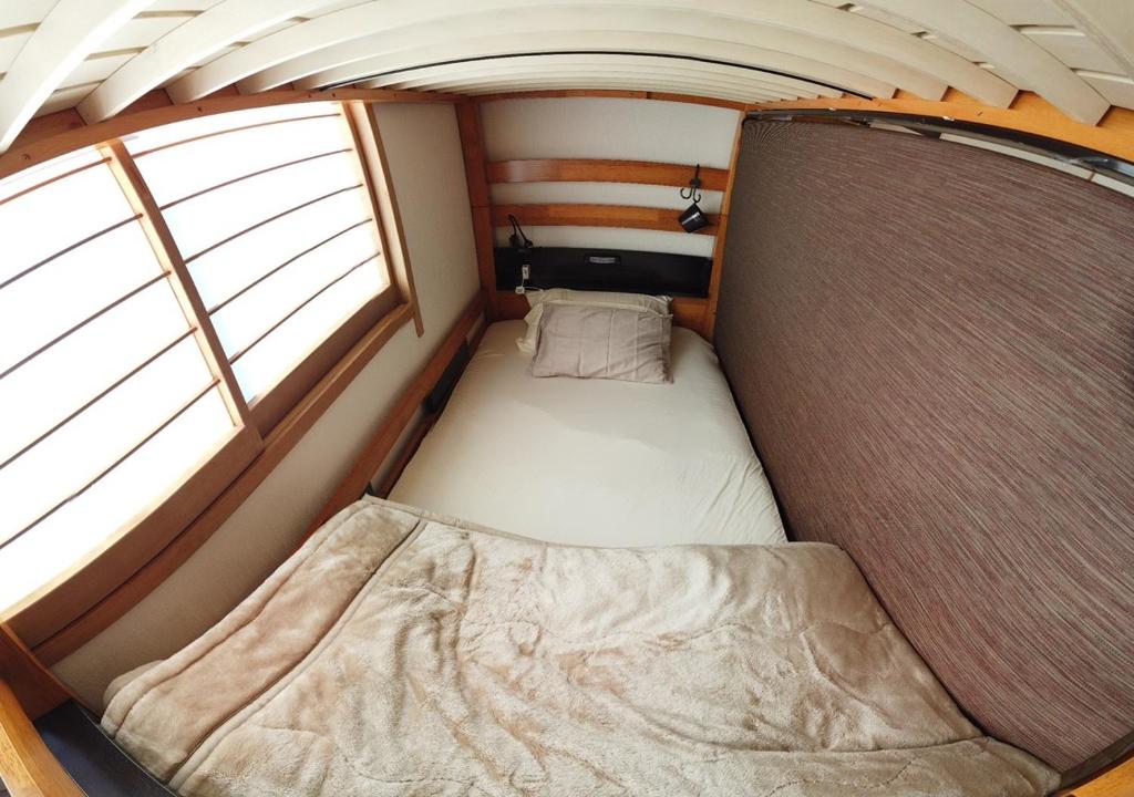 Postel nebo postele na pokoji v ubytování Nono teru Narita