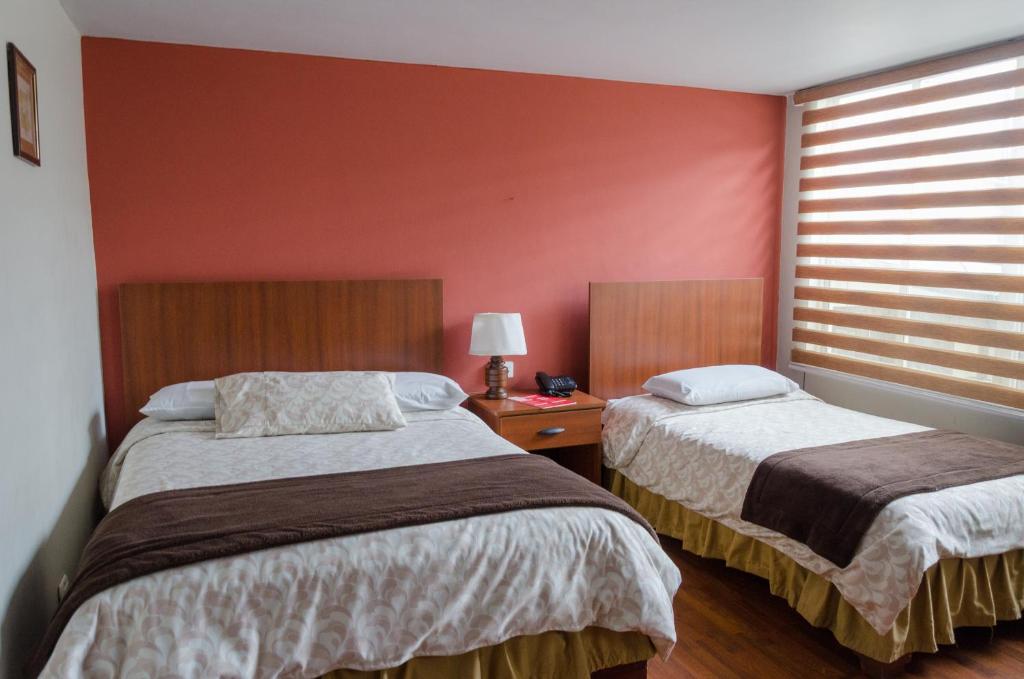 Postel nebo postele na pokoji v ubytování Hotel El Altar