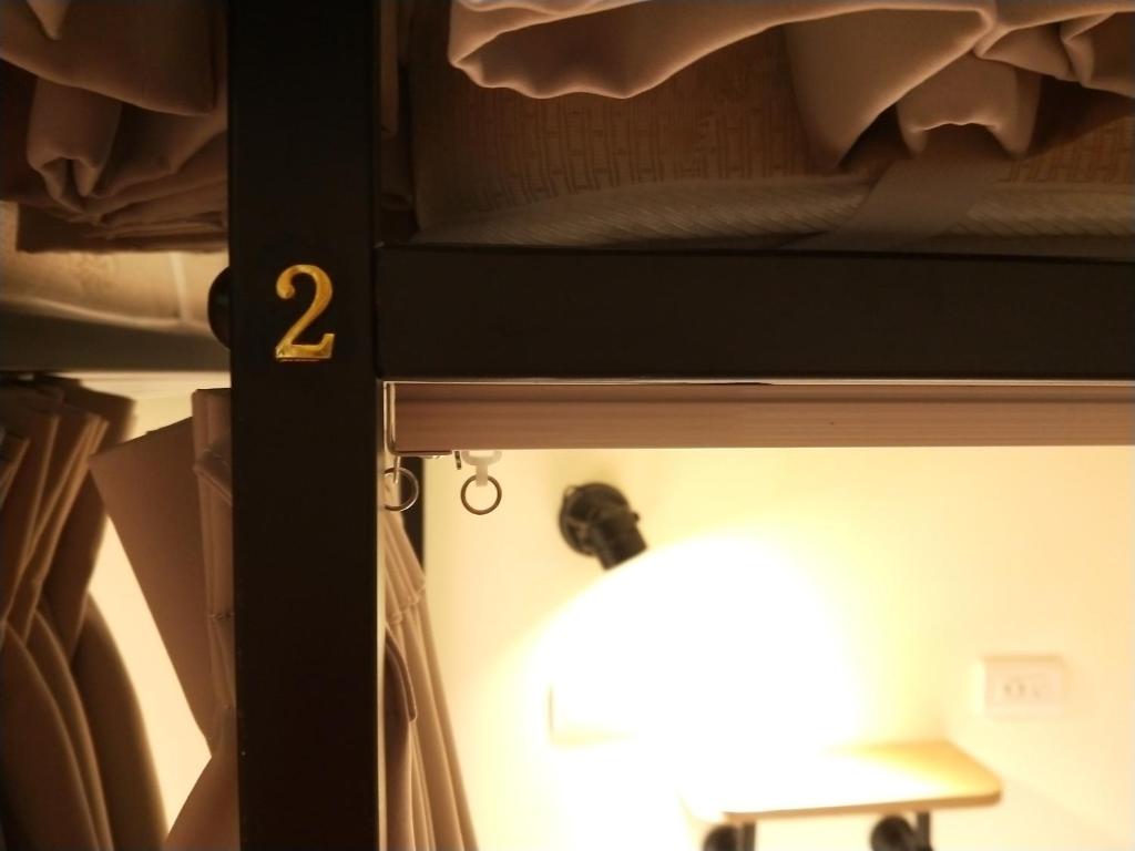 Postel nebo postele na pokoji v ubytování Fuaowo Backpackers Homestay