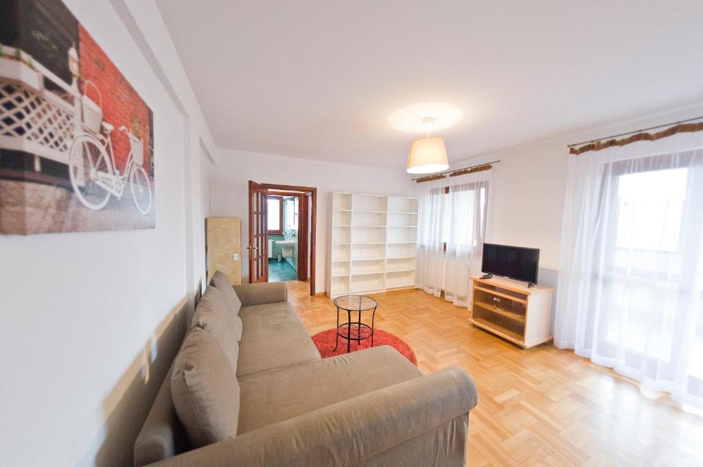Televízia a/alebo spoločenská miestnosť v ubytovaní Villa Verona