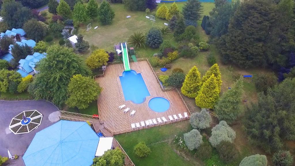 an aerial view of an estate with a swimming pool at Hotel y Cabañas Molino Viejo in Puerto Varas