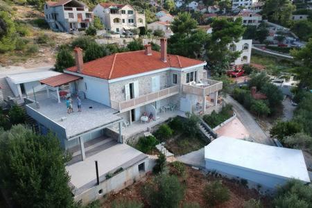 an aerial view of a house with a red roof at Beach Apartment Viktor 2 in Postira