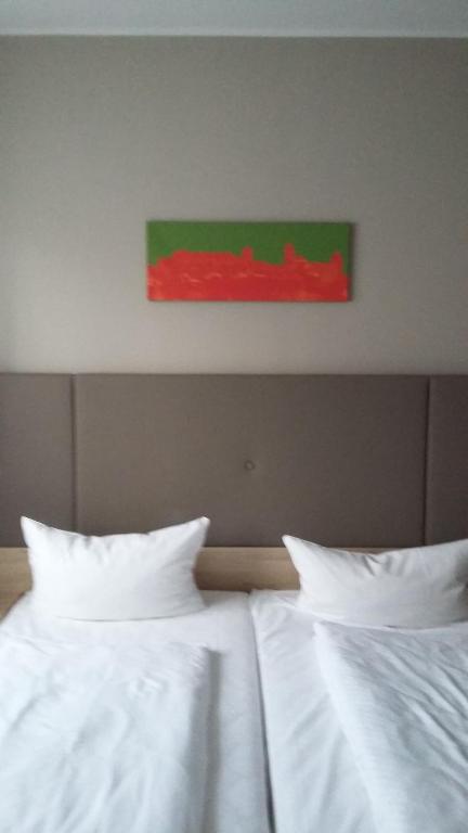 Postel nebo postele na pokoji v ubytování Hotel Alpha