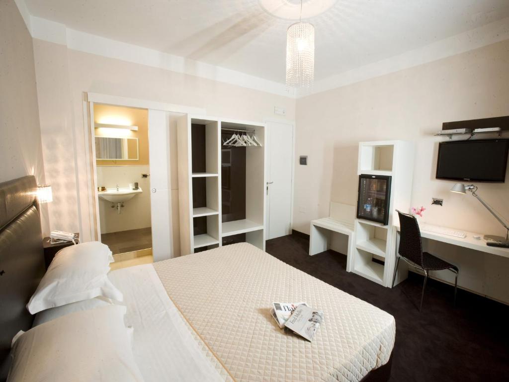 Posteľ alebo postele v izbe v ubytovaní Hotel Bruman