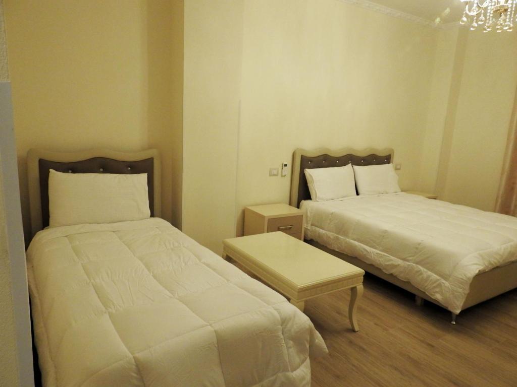 Postel nebo postele na pokoji v ubytování Hotel 3 Vellezerit
