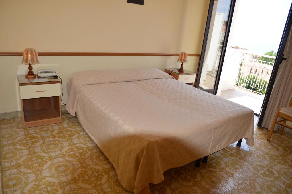 Postel nebo postele na pokoji v ubytování Hotel Virgilio