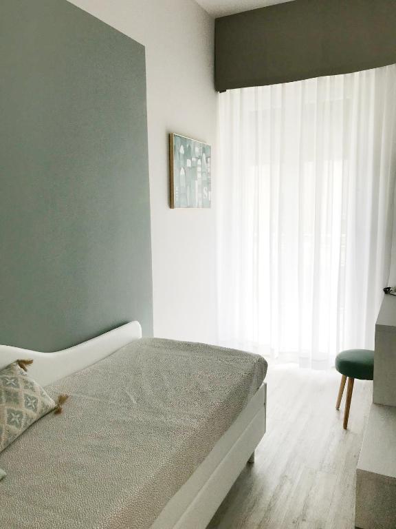 Postel nebo postele na pokoji v ubytování Hotel Flora
