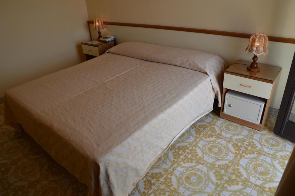 Postel nebo postele na pokoji v ubytování Hotel Virgilio
