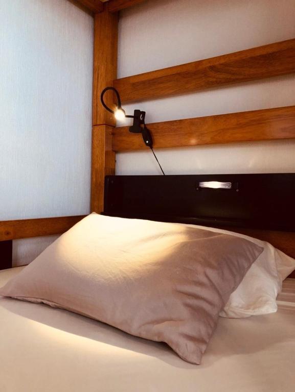 Postel nebo postele na pokoji v ubytování Nono teru Narita