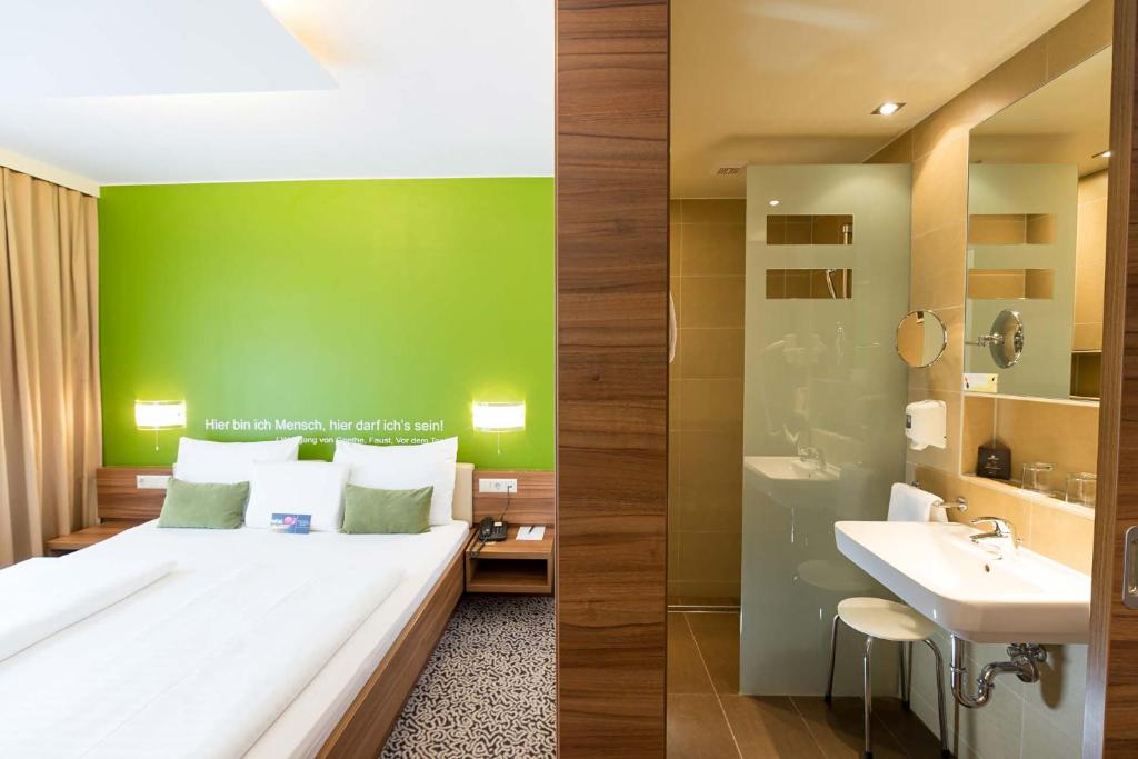 Voodi või voodid majutusasutuse Hotel Süd Graz toas