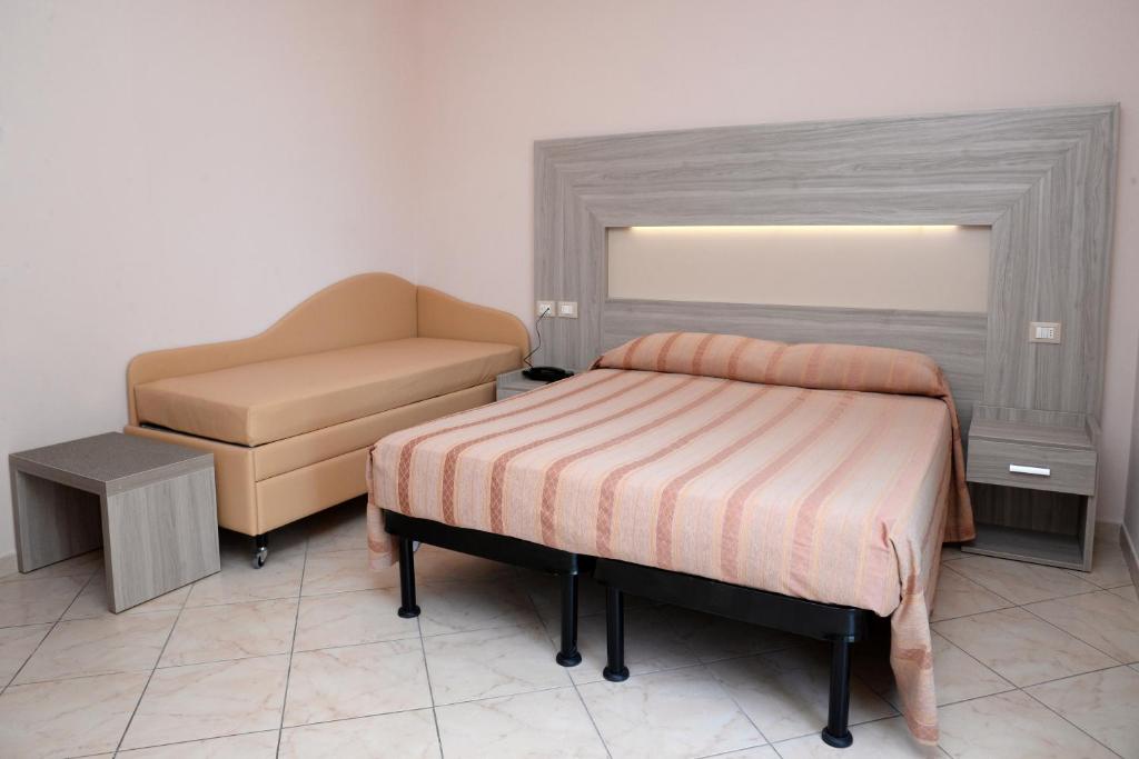 Postel nebo postele na pokoji v ubytování Hotel Concorde
