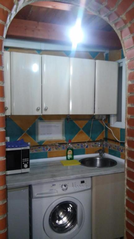 A kitchen or kitchenette at Central Apartment Madrid