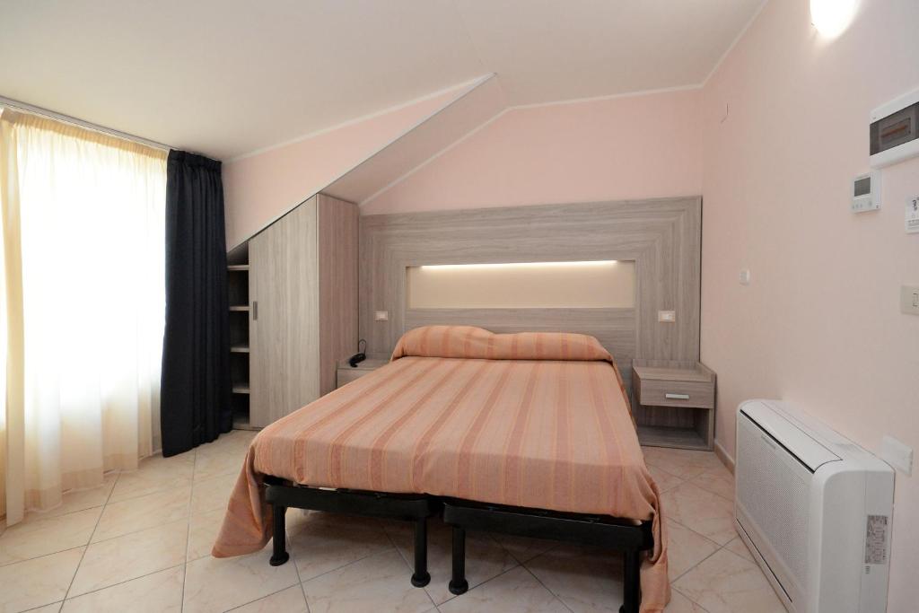 Postel nebo postele na pokoji v ubytování Hotel Concorde
