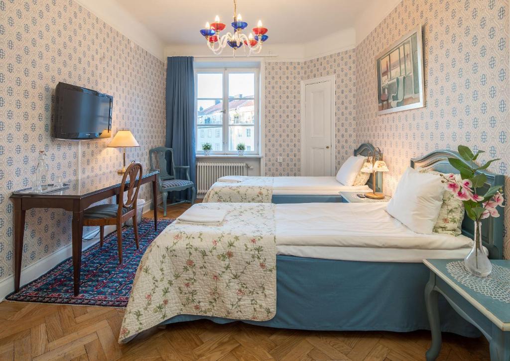Postel nebo postele na pokoji v ubytování Wasa Park Hotel