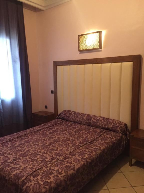 Postel nebo postele na pokoji v ubytování Hotel Boustane