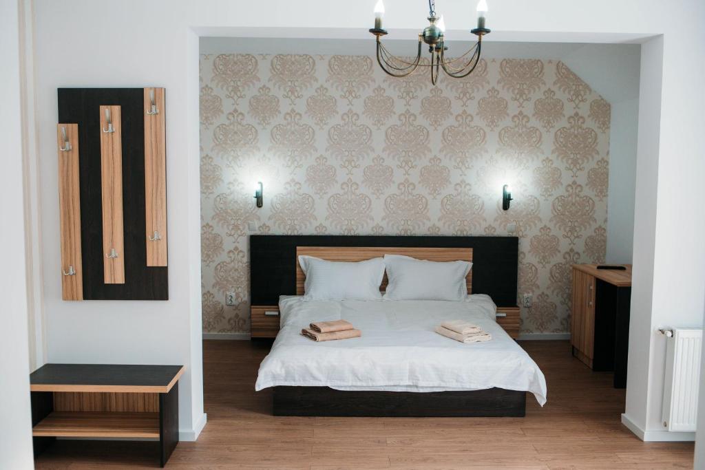 Posteľ alebo postele v izbe v ubytovaní Casa Mindru