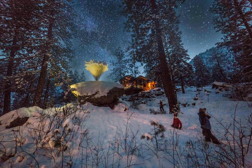 a painting of people in the snow at night at Sleeping Lady Mountain Resort in Leavenworth