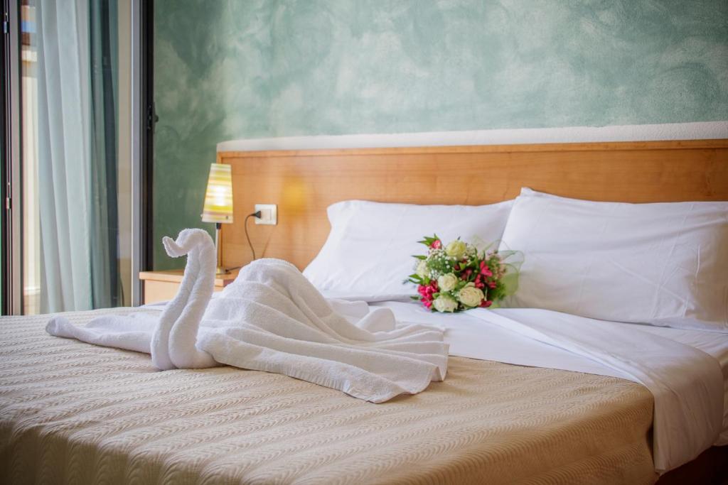 Postel nebo postele na pokoji v ubytování Abbaidda Hotel