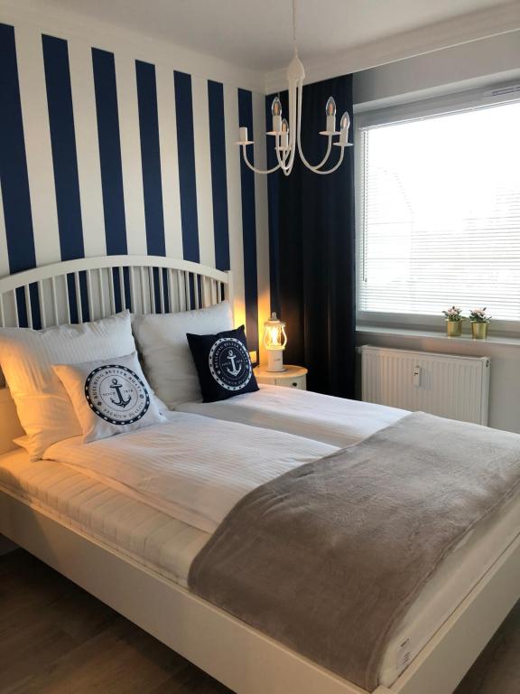 Posteľ alebo postele v izbe v ubytovaní Apartament Bliżej Morza Premium I