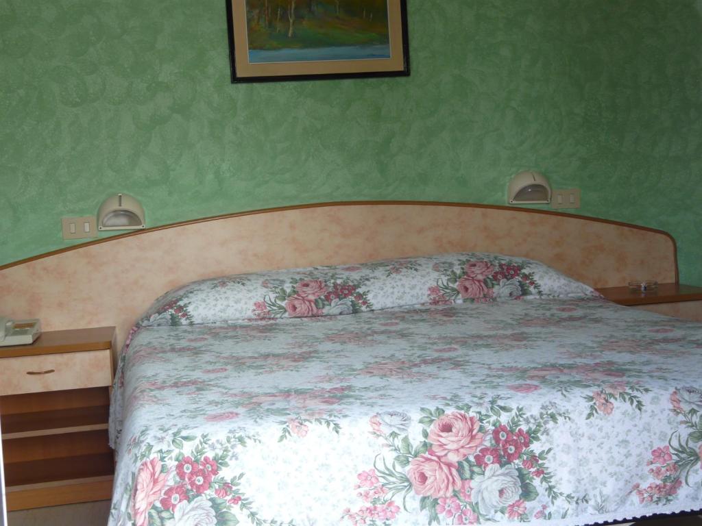 Postel nebo postele na pokoji v ubytování Hotel Vecchia Rimini