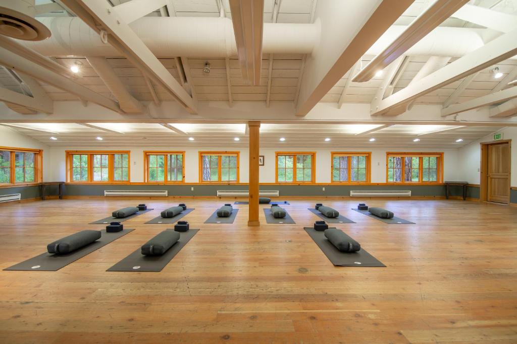 a yoga class with many pillows in a room at Sleeping Lady Mountain Resort in Leavenworth