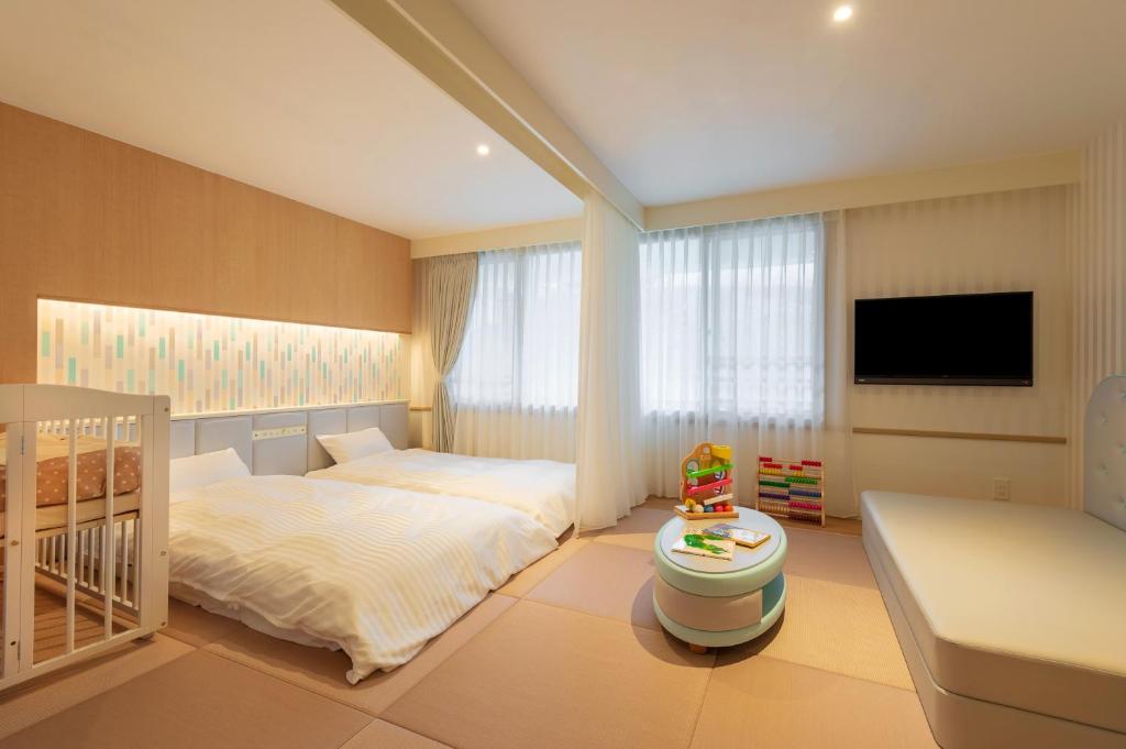 Postel nebo postele na pokoji v ubytování Lime Resort Myoko