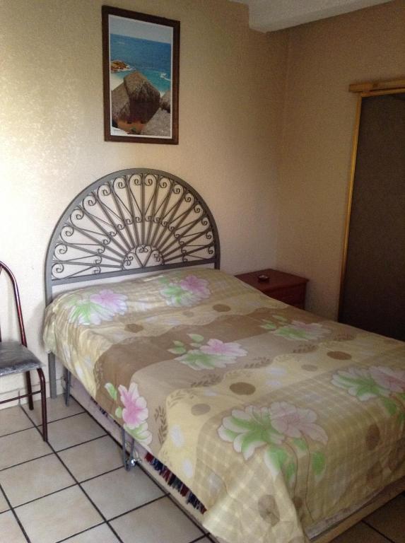 Postel nebo postele na pokoji v ubytování Hotel Palacio