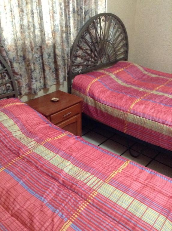 Postel nebo postele na pokoji v ubytování Hotel Palacio