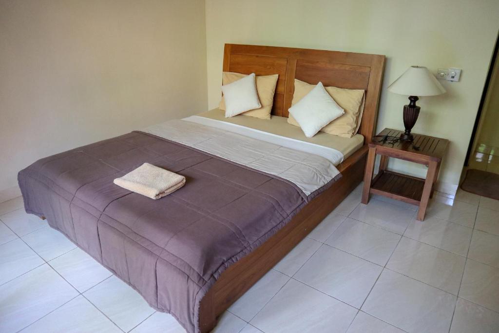 Postel nebo postele na pokoji v ubytování Ubud Canti House