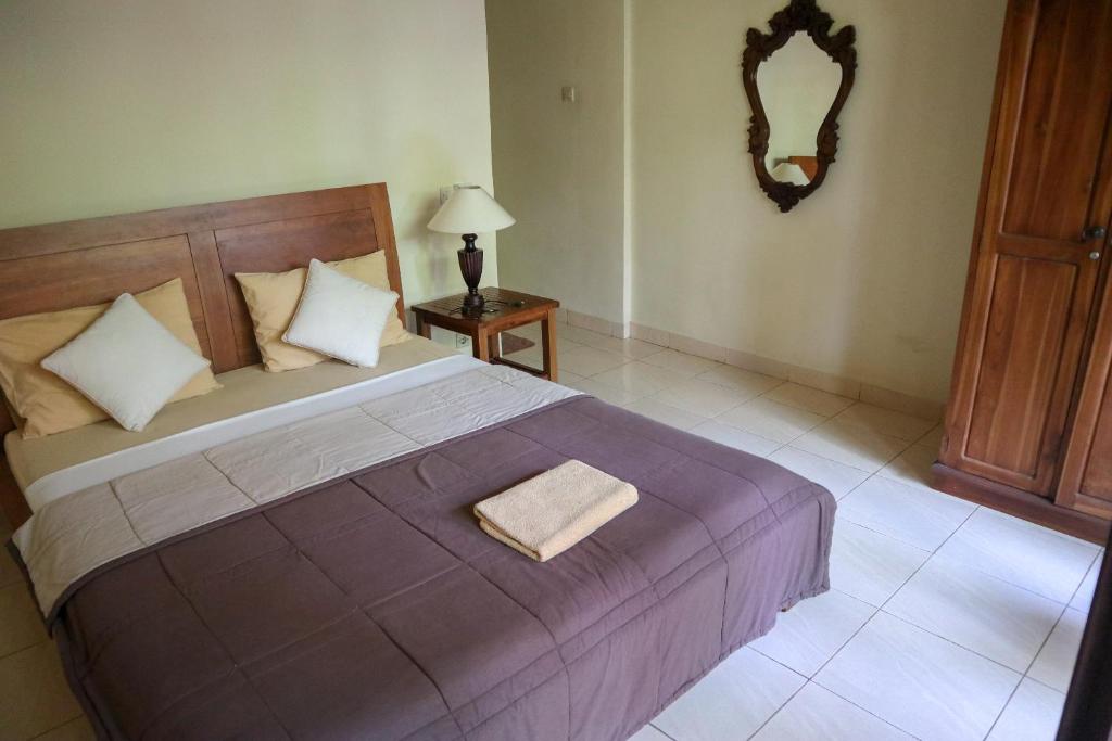 Postel nebo postele na pokoji v ubytování Ubud Canti House