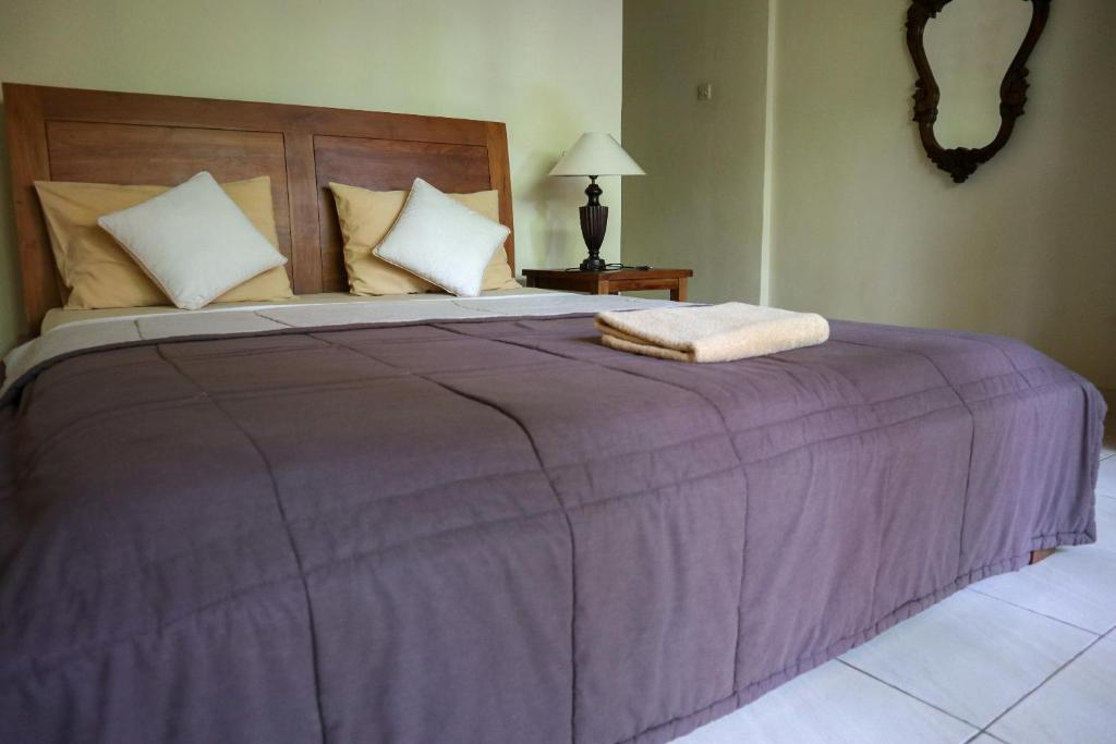 Postel nebo postele na pokoji v ubytování Ubud Canti House
