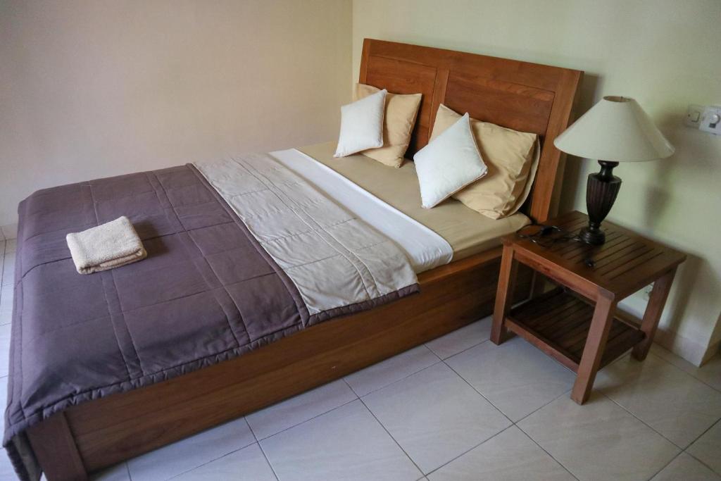 Postel nebo postele na pokoji v ubytování Ubud Canti House