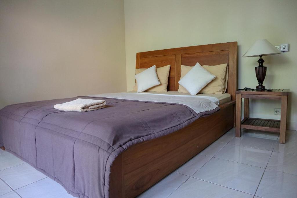 Postel nebo postele na pokoji v ubytování Ubud Canti House