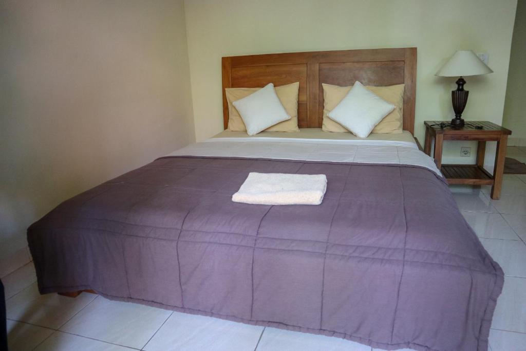 Postel nebo postele na pokoji v ubytování Ubud Canti House