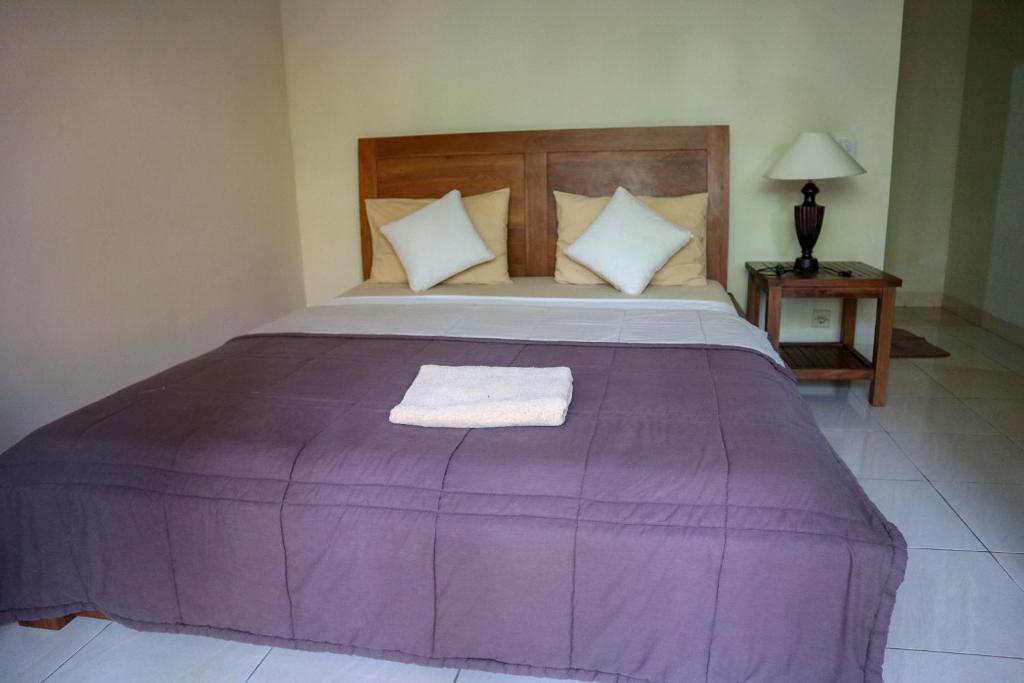 Postel nebo postele na pokoji v ubytování Ubud Canti House