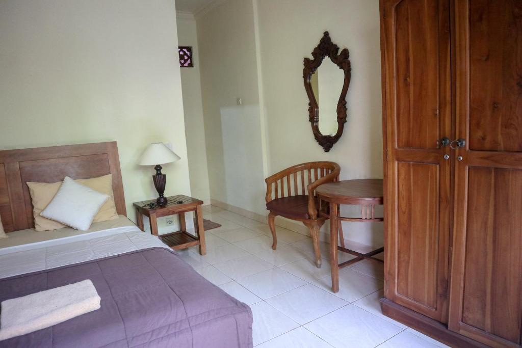 Postel nebo postele na pokoji v ubytování Ubud Canti House